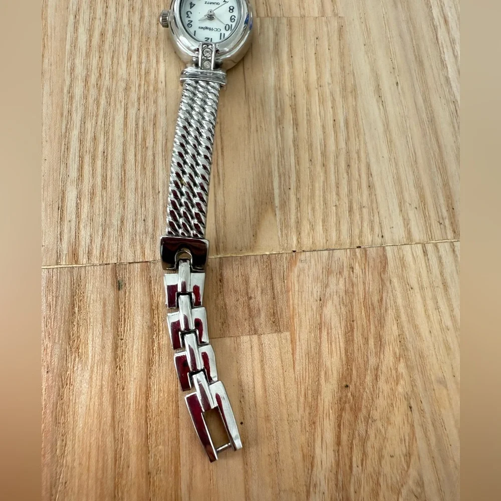 CC Hughes ladies oval silver tone watch NEW BATTERY